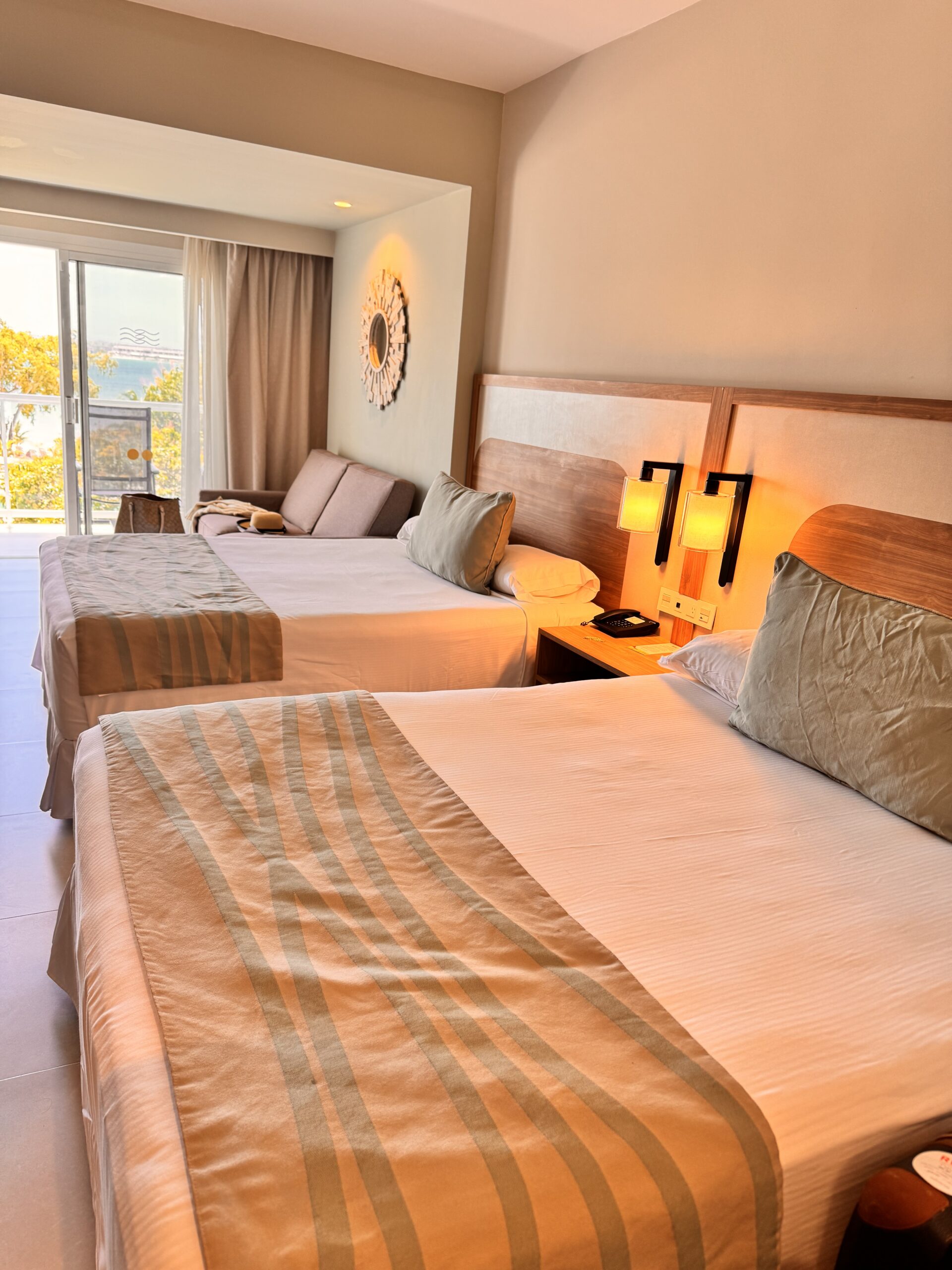 The room at Riu Negril with two beds and a balcony overlooking the beach