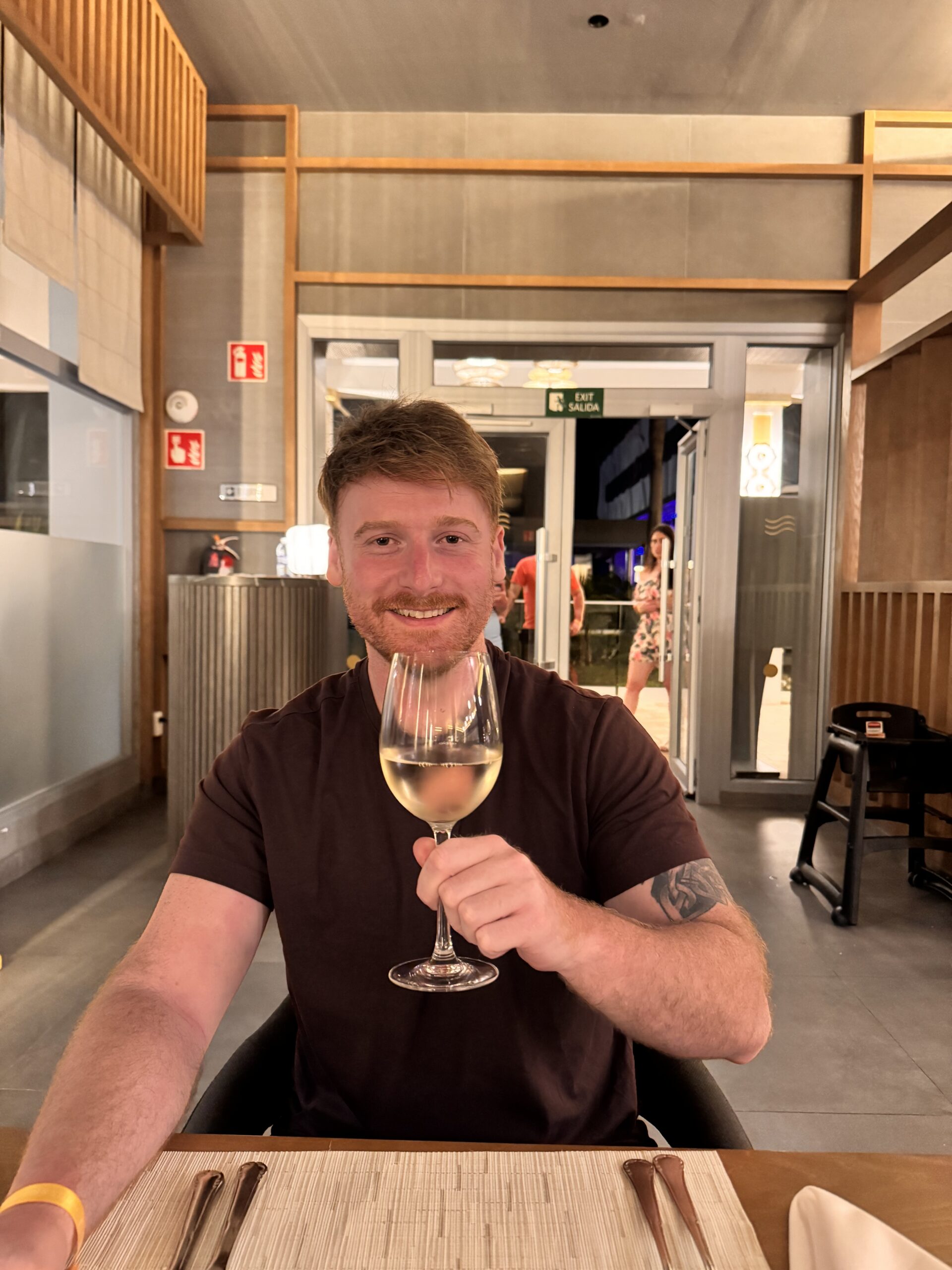 Mark at dinner with a glass of wine