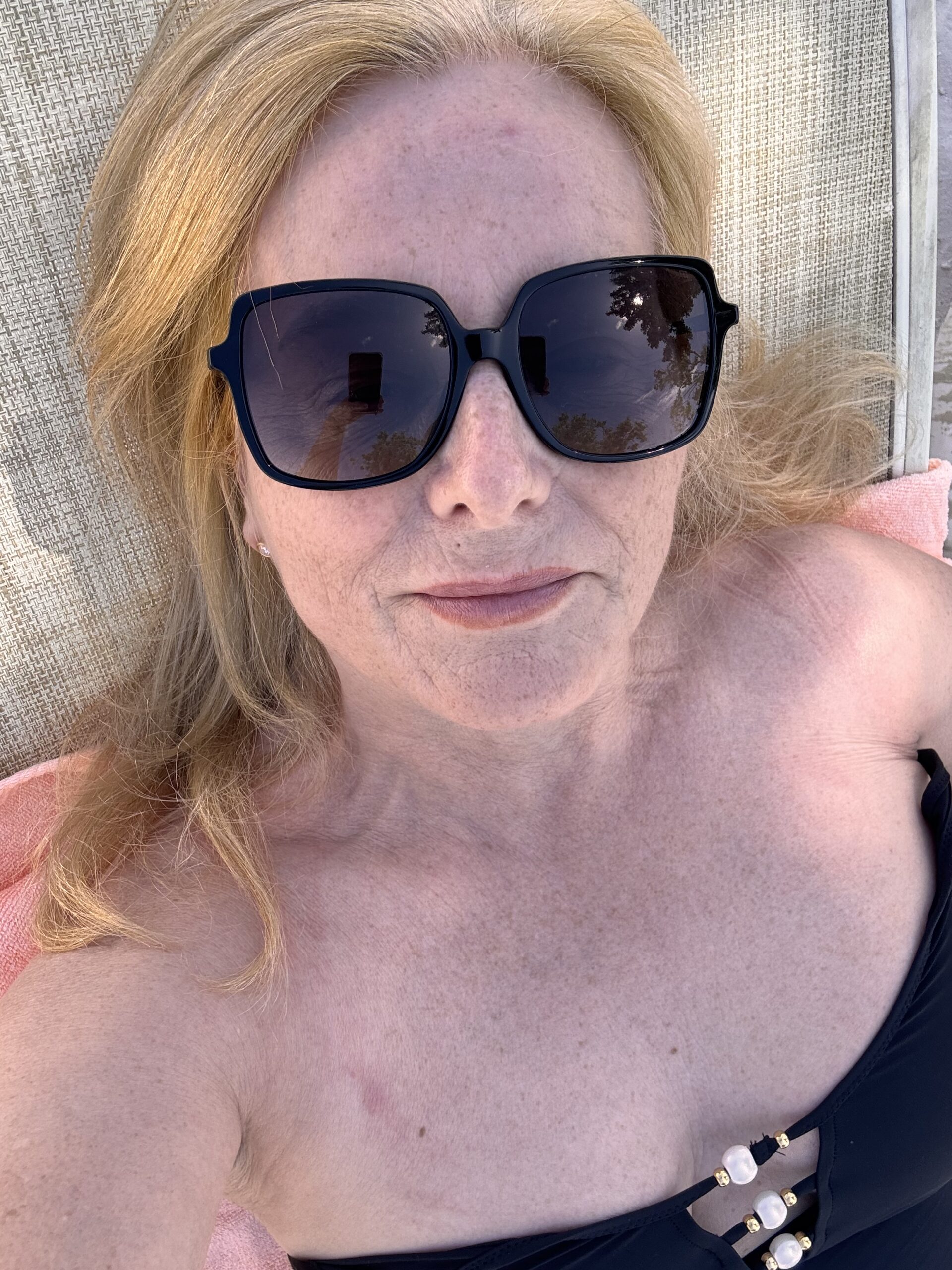 Clare relaxing on a lounger on the beach