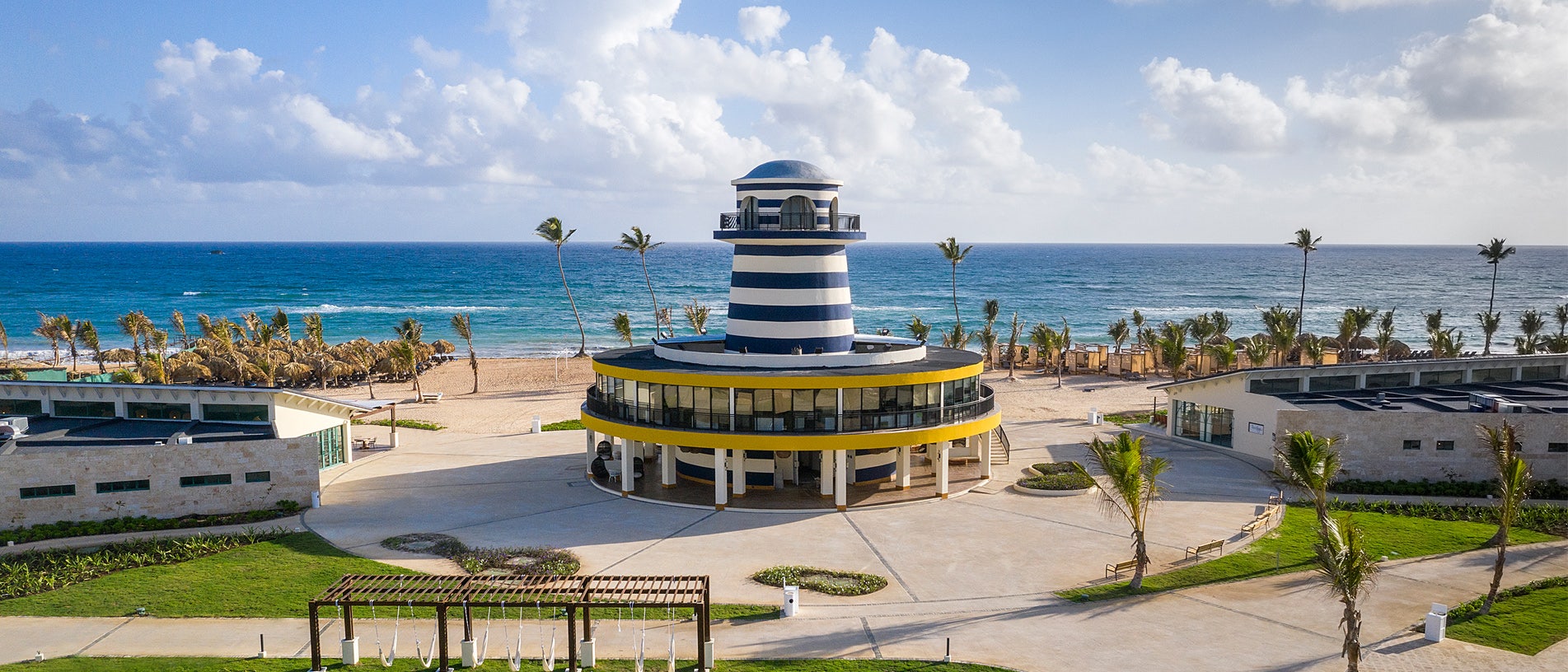 The pool and seafront grounds at Ocean El Faro Resort in Punta Cana