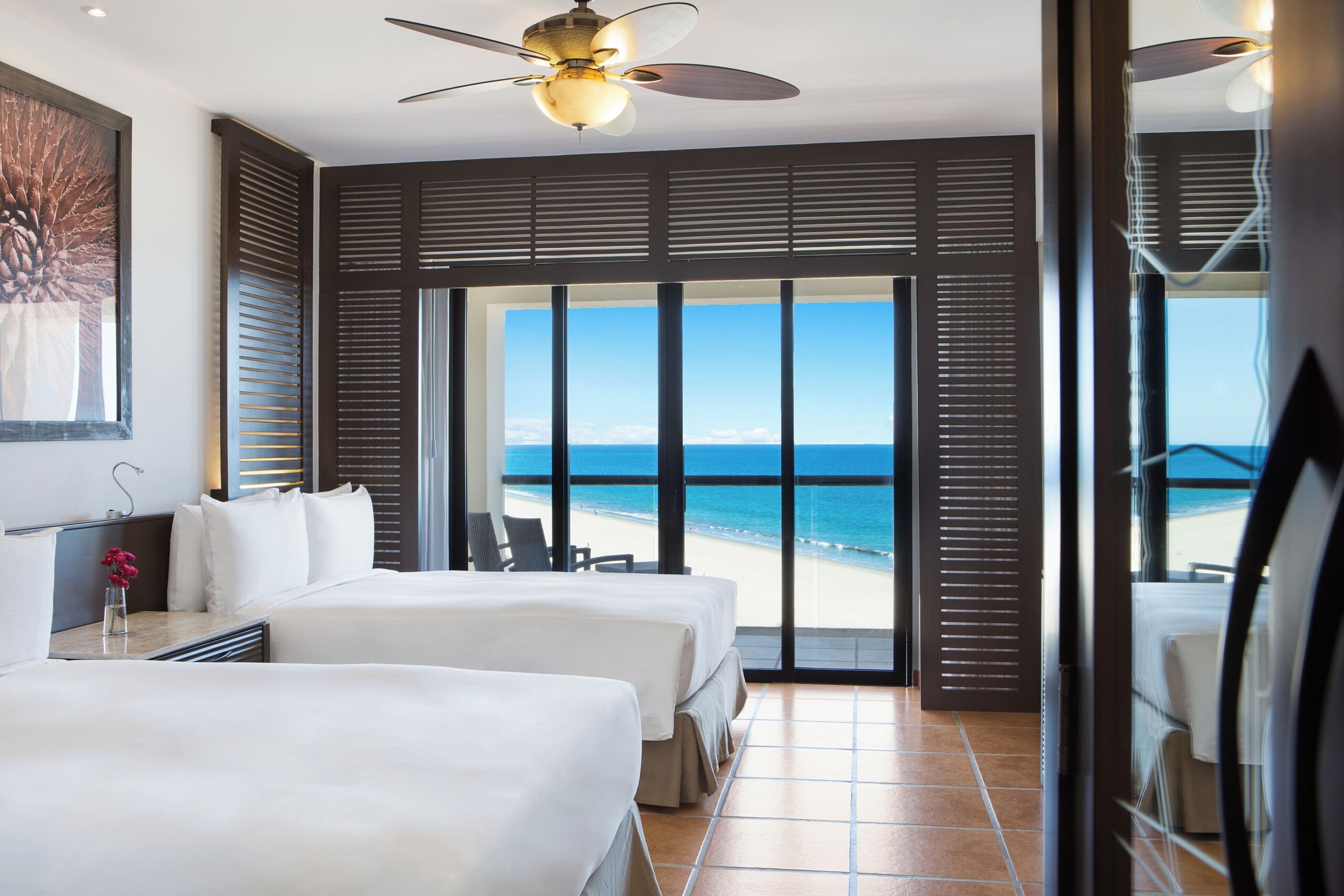 Beachfront guest room with ocean-view doors at Hyatt Ziva Los Cabos