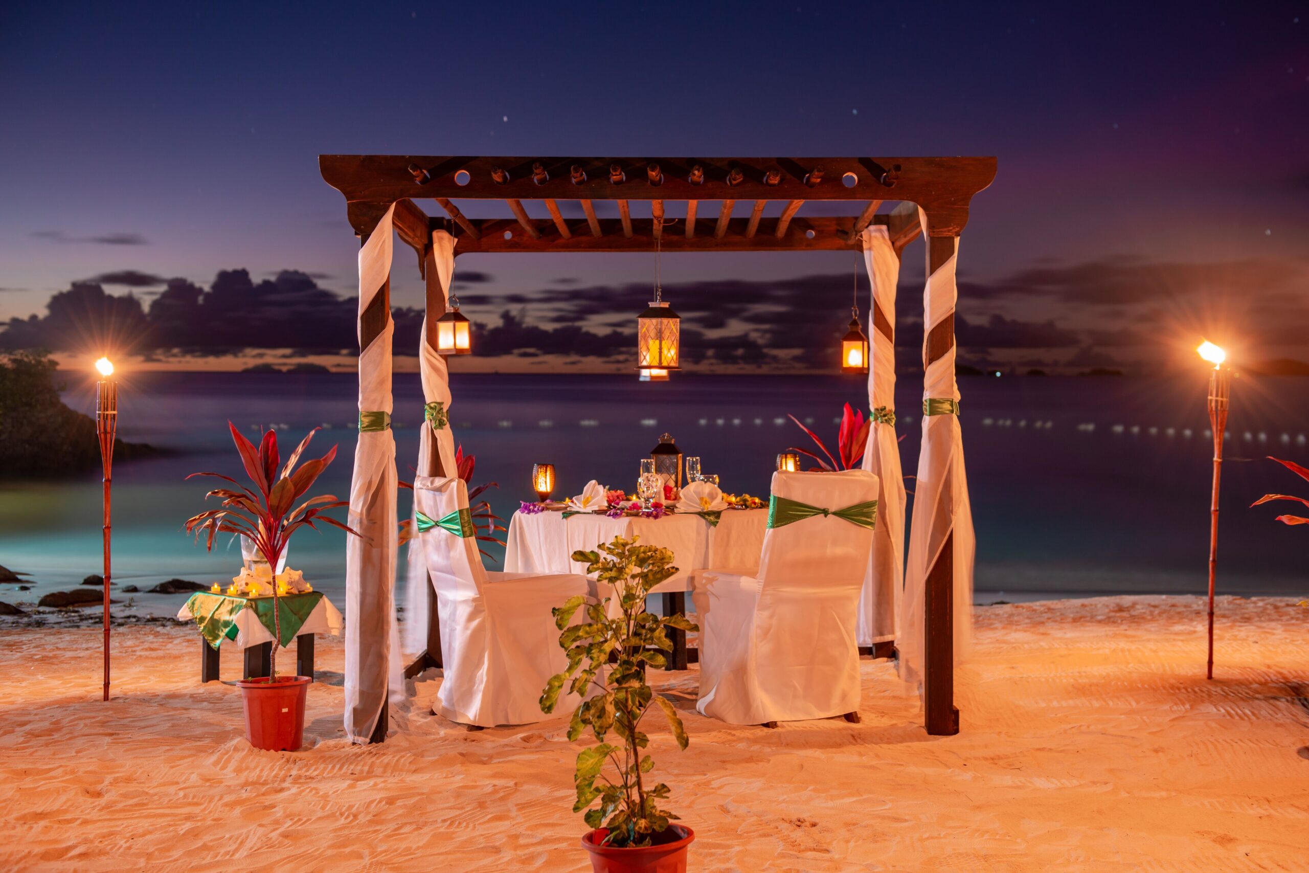 A private sunset dinner setup on the bluff at Cocos Hotel Antigua