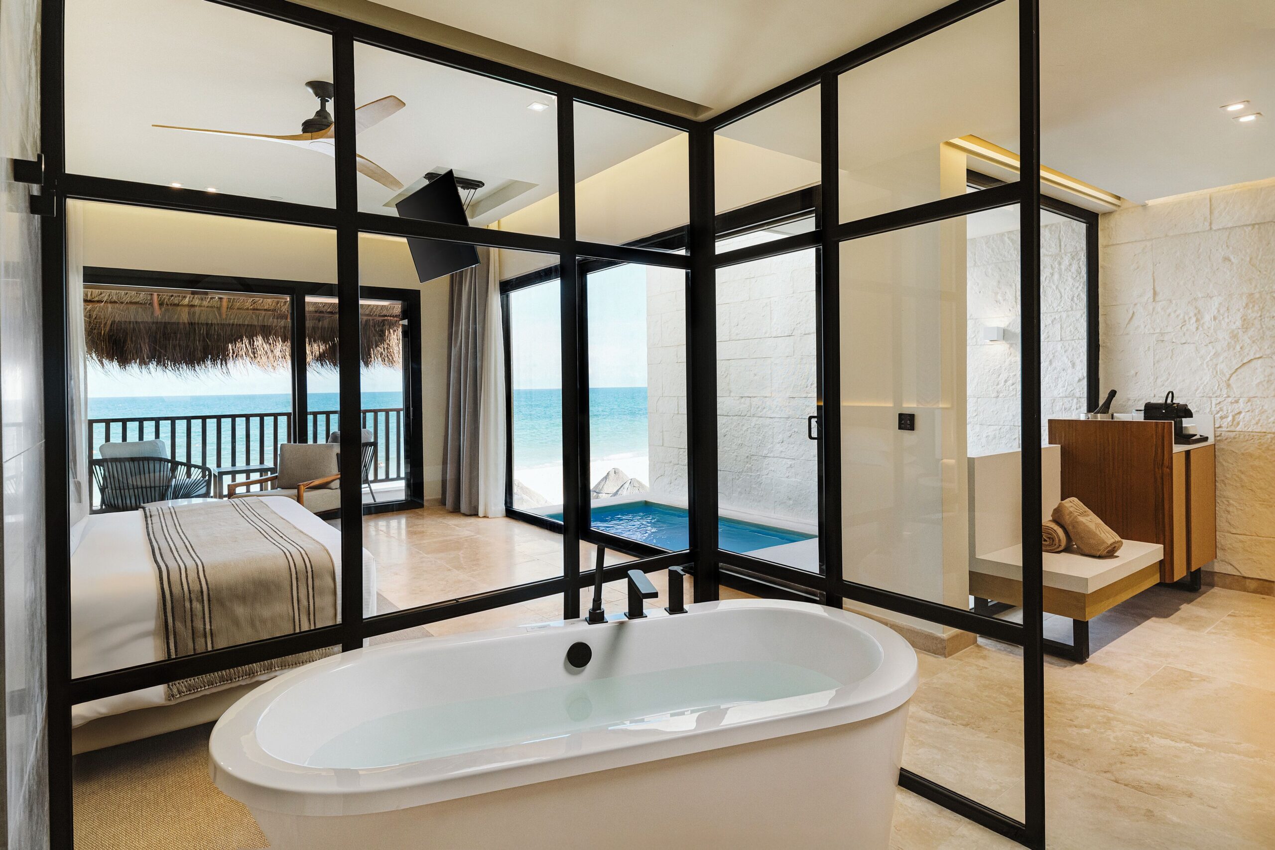 Modern oceanfront suite with soaking tub and private plunge pool at Valentin Imperial Riviera Maya