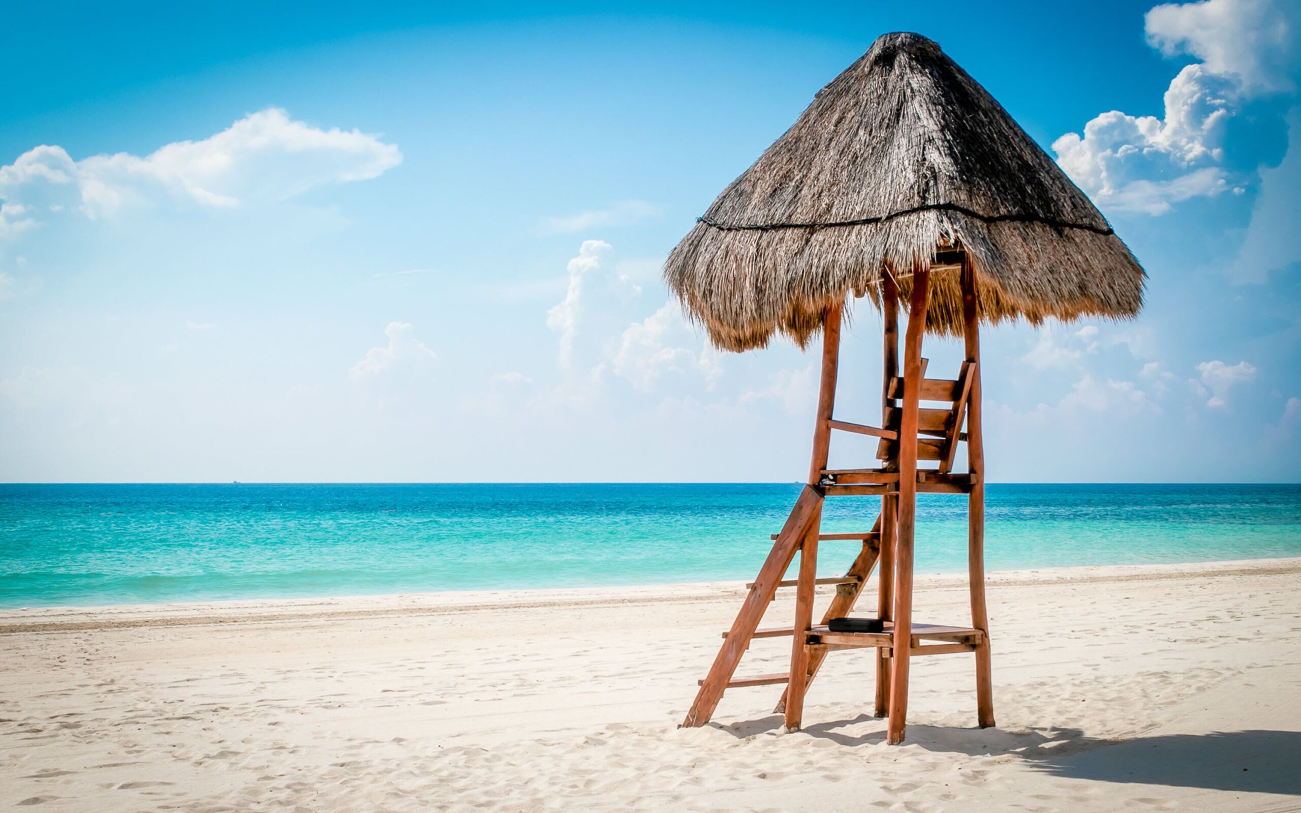 The white sand beach and turquoise Caribbean water at Valentin Imperial Riviera Maya on Playa del Secreto