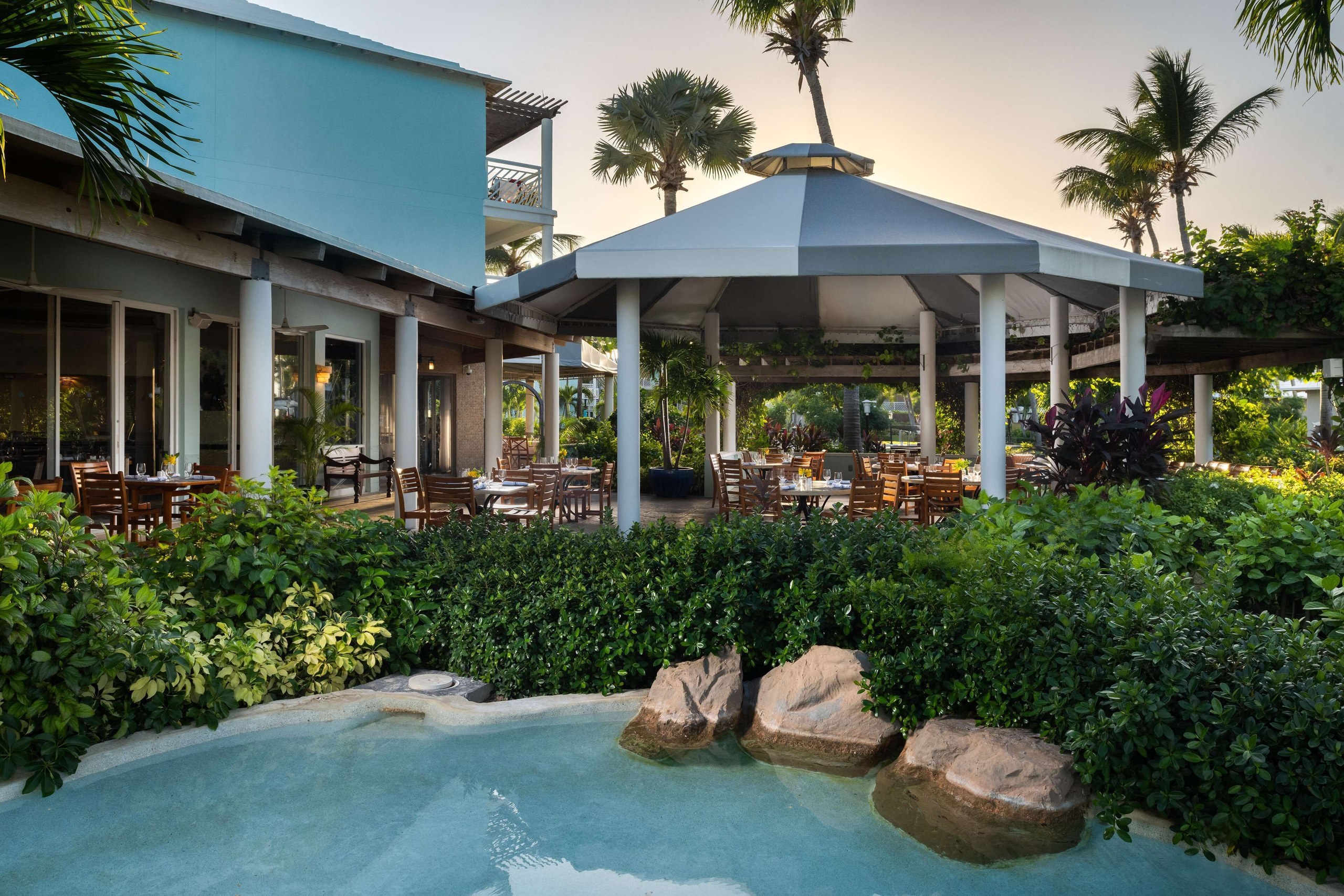 Outdoor resort dining beside a pool at Beaches Turks and Caicos