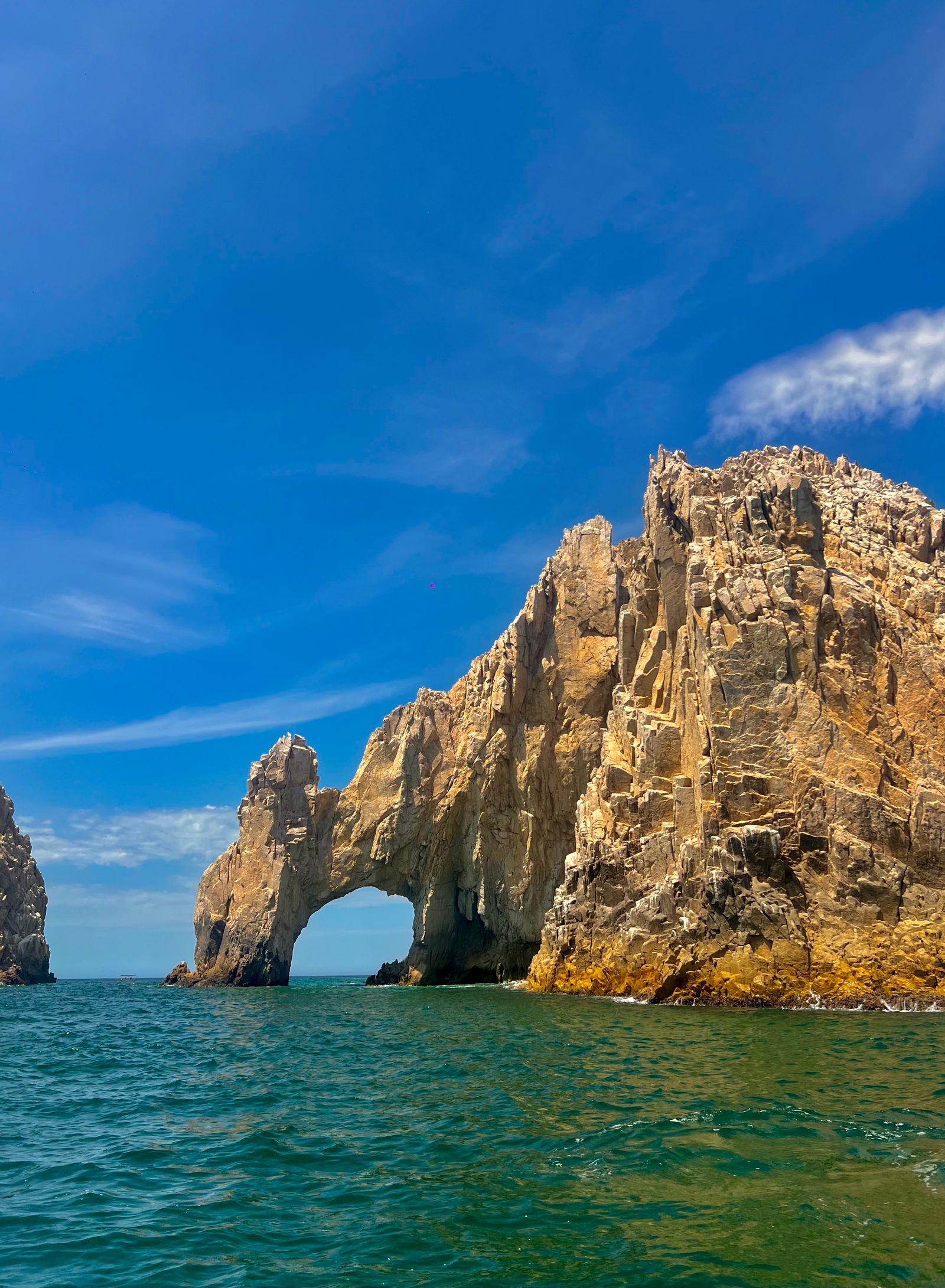 Waves breaking against rock formations in Cabo San Lucas, Mexico