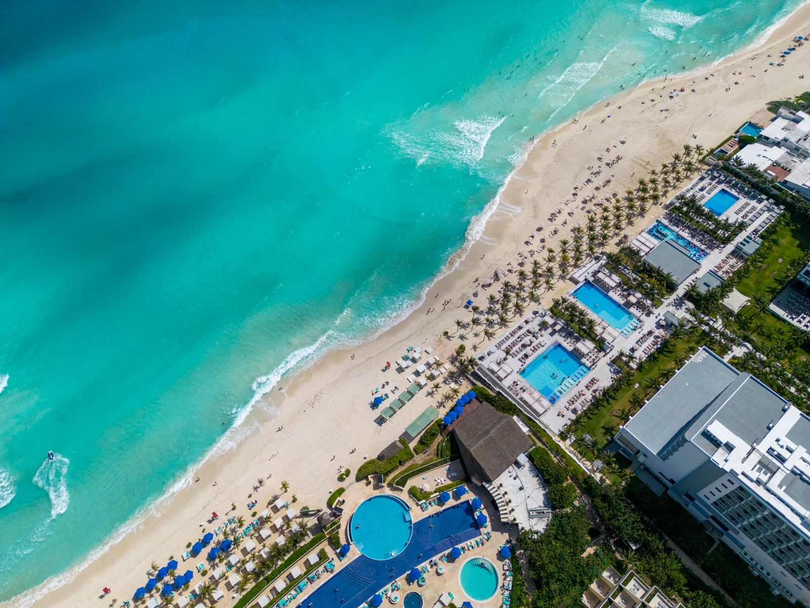 Aerial view of a Cancun resort beach with turquoise water and white sand