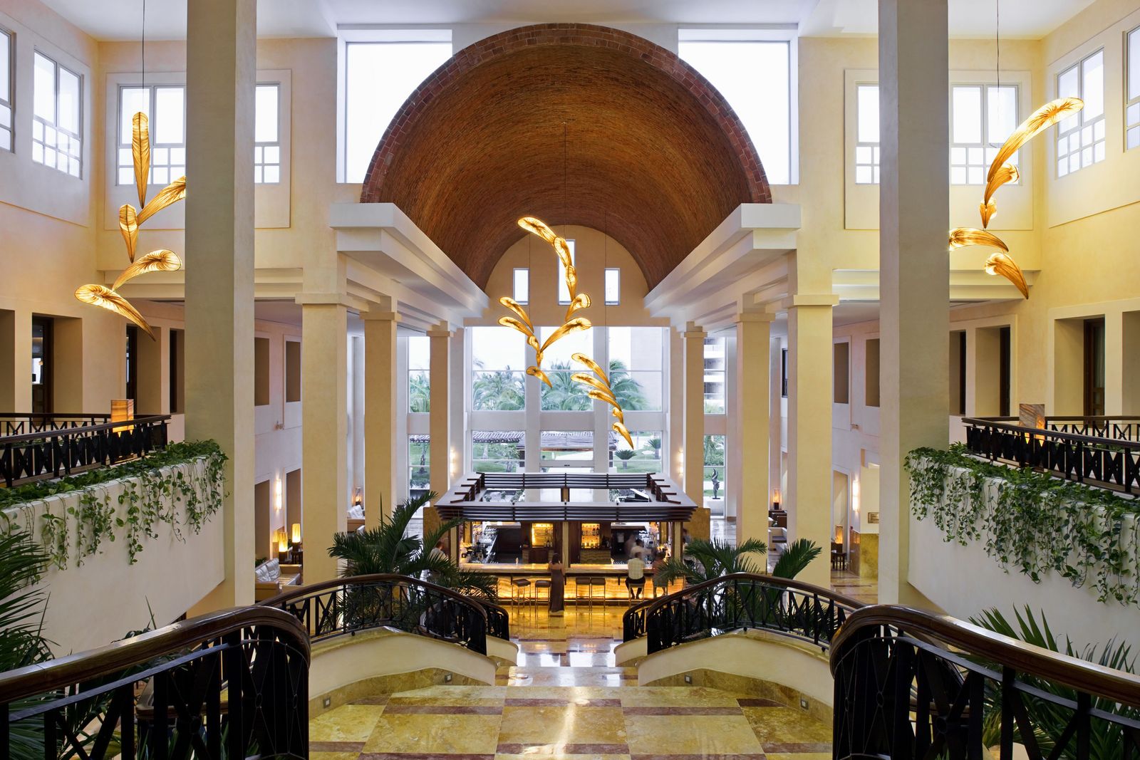 The lobby bar beneath the barrel-vaulted ceiling at Excellence Playa Mujeres