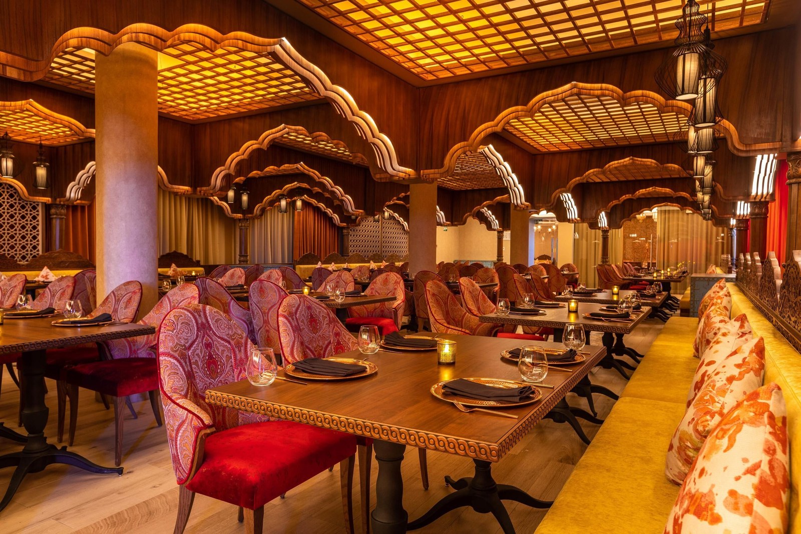 Dining room with carved wood and patterned chairs at a Moon Palace Cancún restaurant